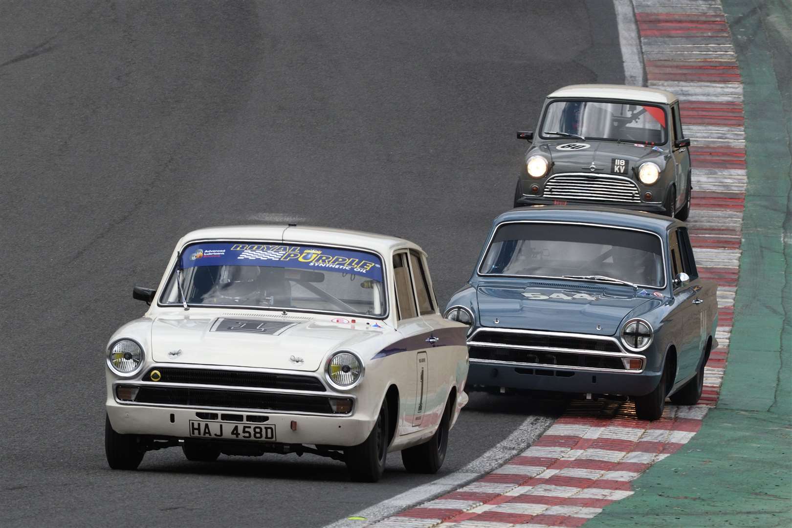 Mike Gardiner (1) scored victory in the first Historic Touring Car race in his 1965 Ford Lotus Cortina