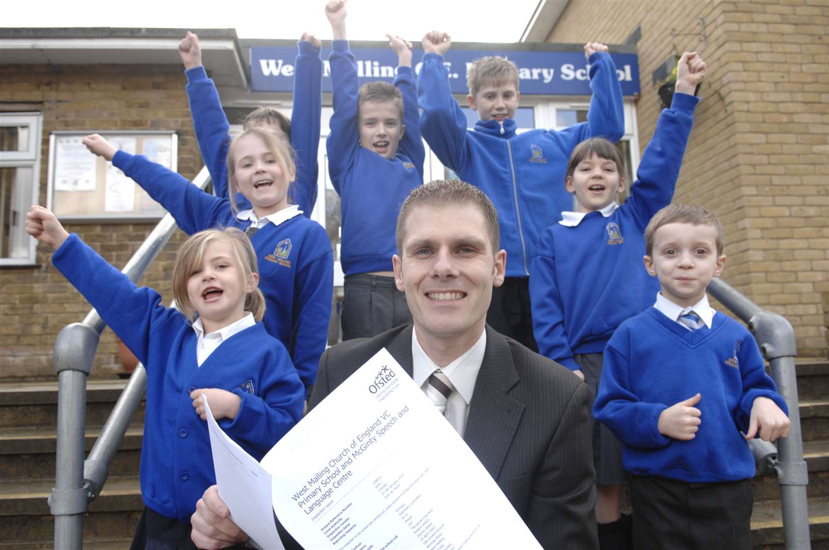 Mr Webb with pupils from West Malling CofE Primary celebrating their Good Ofsted report in 2010