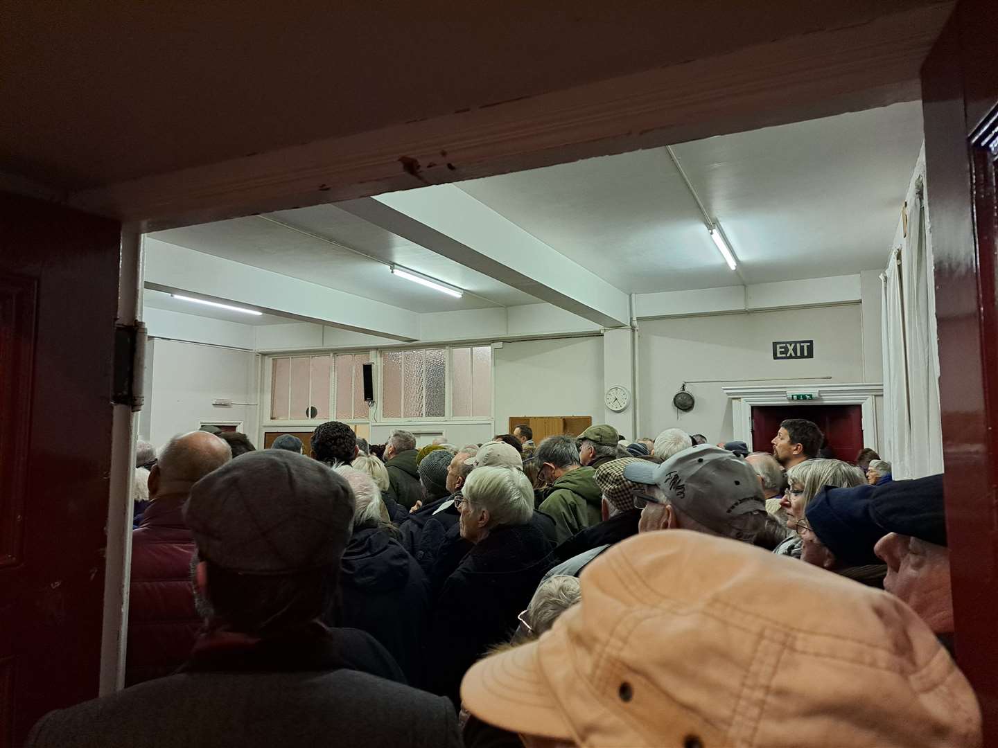 People crowded into the entryway of the United Reform Church hall in Herne Bay in an attempt to hear those speaking at the meeting