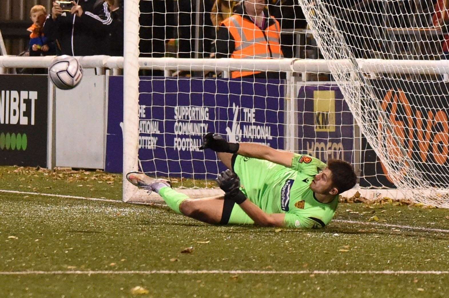 Tom Hadler makes the winning penalty save in Maidstone's FA Trophy victory over Billericay Picture: Steve Terrell