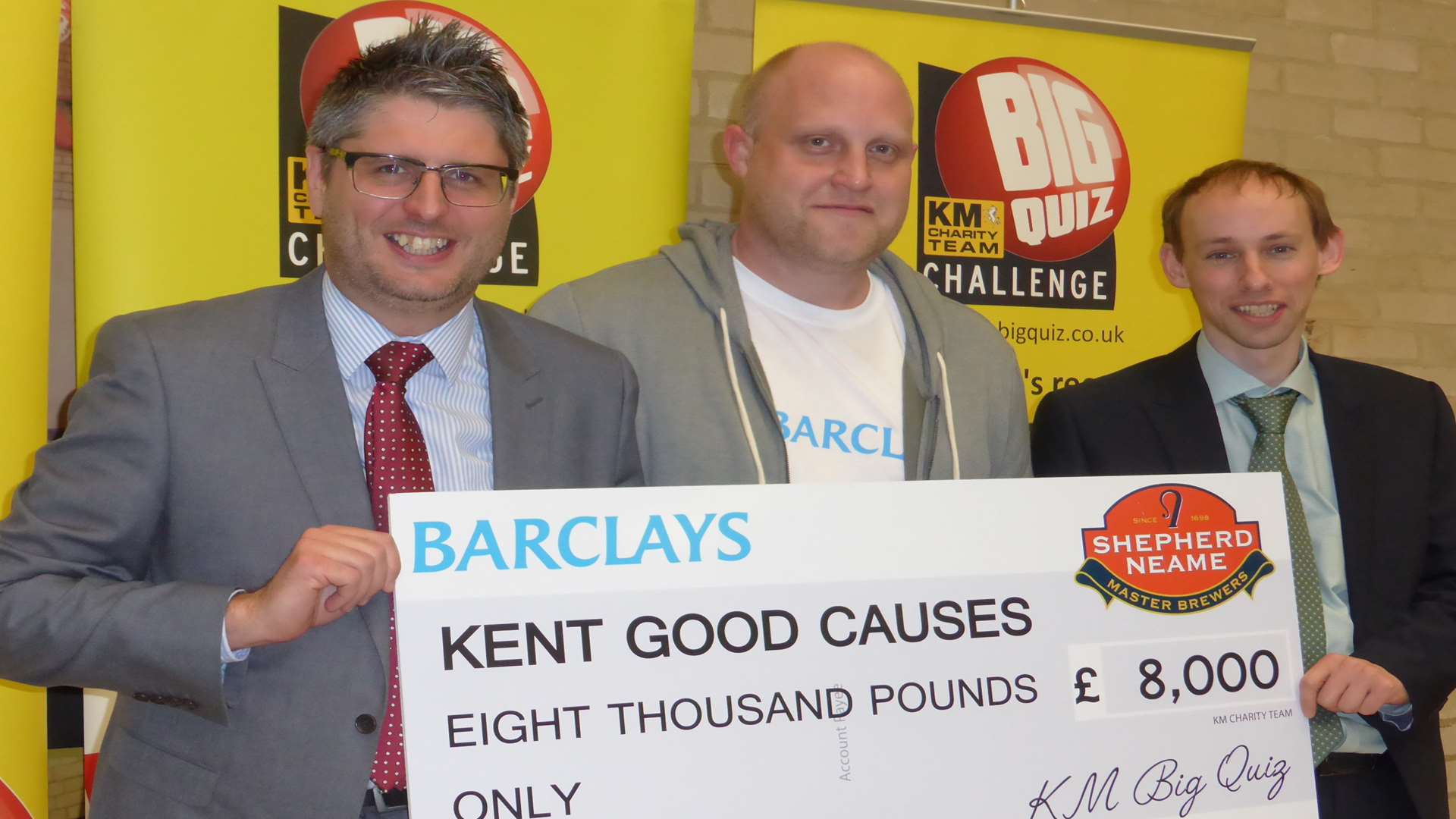 Kentish Gazette editor Leo Whitlock, Barclays Canterbury manager Sam Russell and James Durell of MHA MacIntyre Hudson with the cheque at the Canterbury heat of the KM Big Charity Quiz staged at the University of Kent sports hall on Friday, April 22.