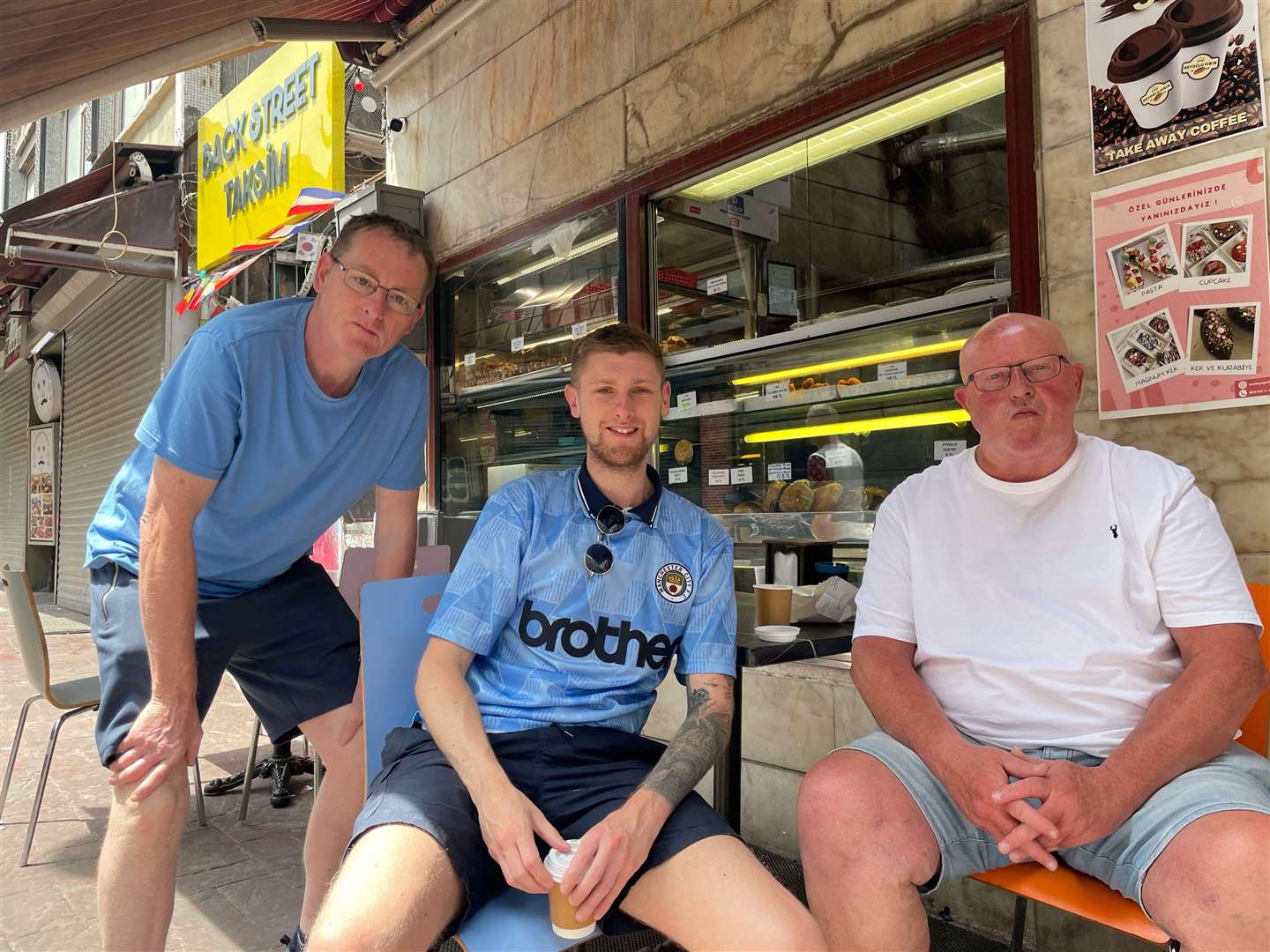 Man City fans (left to right) Wayne Jeffries, 59, Stephen Woods, 30, and Dave Faulkner, 63, in central Istanbul (Luke O’Reilly/PA)