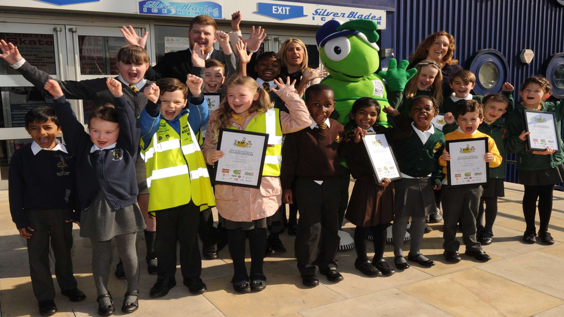 KM Walk to School and Buster’s Book Club pupils celebrate Spring Challenge Day victory with key partners Medway Council and Specsavers at Silver Blades Ice Rink, Gillingham