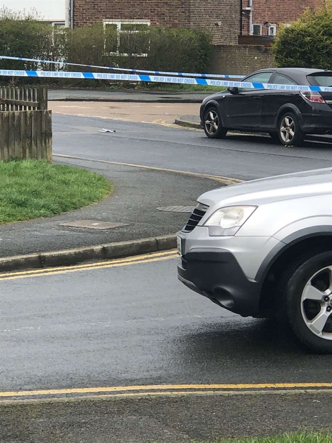 Police taped off the road at Brookfield Road, Ashford after the murder