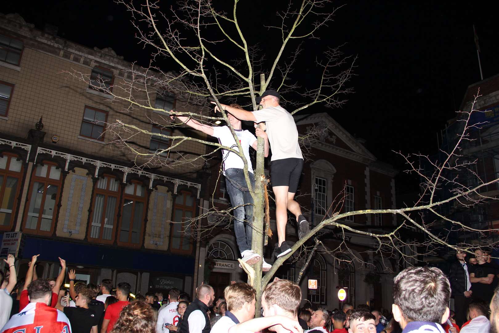 Some braver fans climbed an unsteady looking tree in Maidstone town centre. Heidi Harrison-Steele