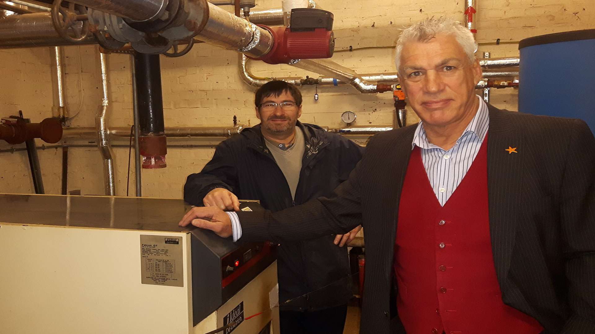 Head teacher Stuart Pywell and caretaker Keith Burgess in the school's boiler room