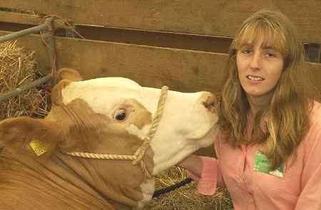 Gemma Austen, of Ashford Young Farmers, with a Charolais cross at last year's show. Picture: PAUL DENNIS