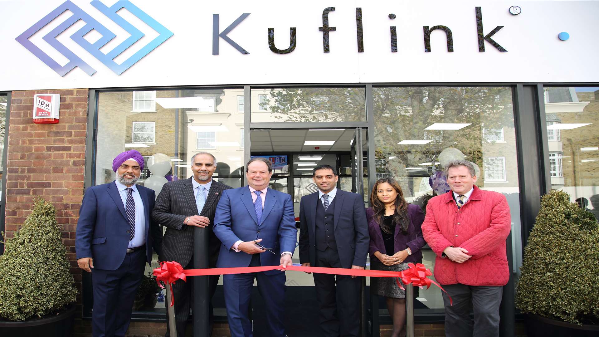 The Kuflink office is opened by, from left, Harwinder Singh, Rawinder Singh Binning, Stephen Hammond MP, Tarlochan Garcha, Darshana Ubl and Adam Holloway MP
