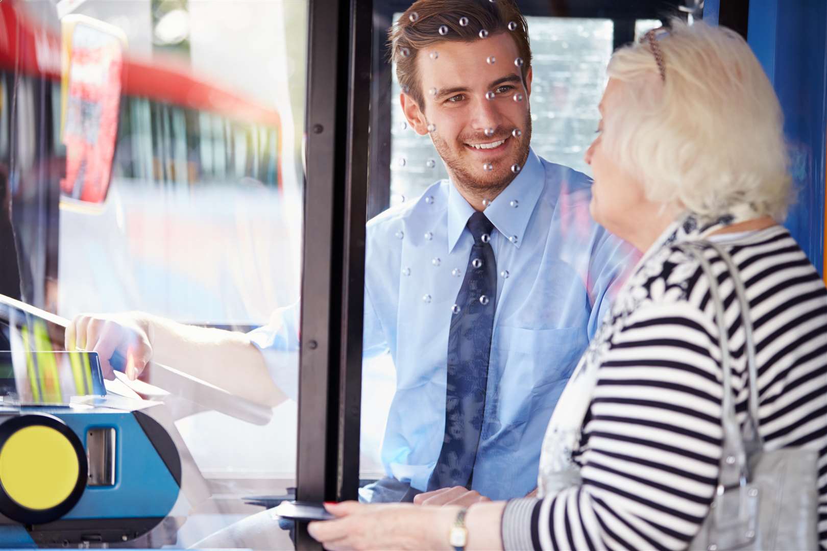 Senior woman boarding bus and buying ticket. Picture: Getty Images