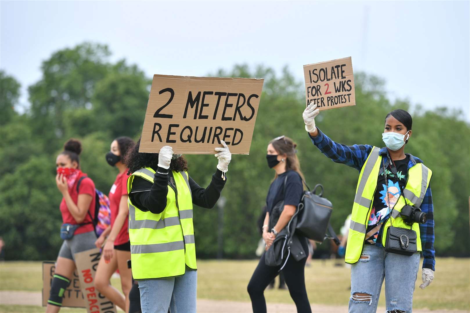 Stewards direct people as they begin to gather ahead of the protest (Dominic Lipinski/PA)