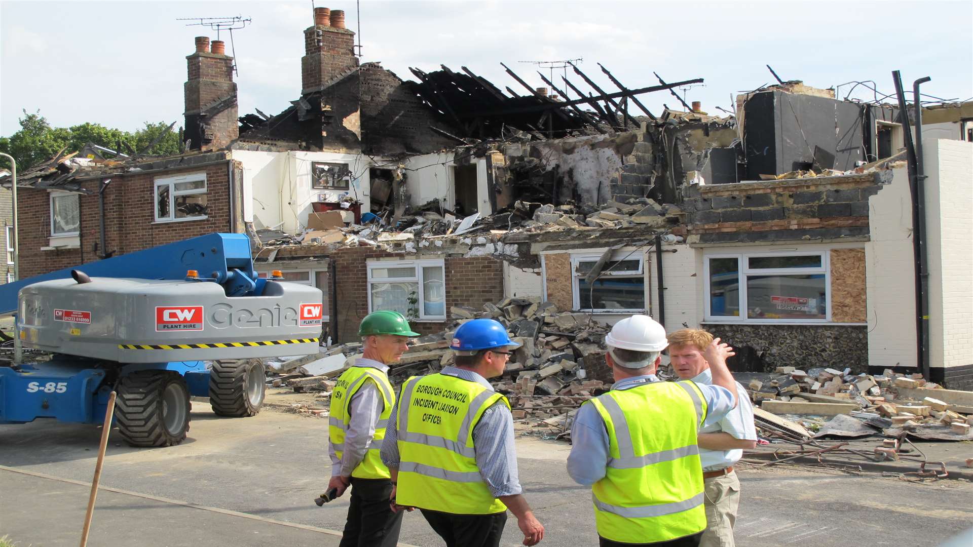 Engineers discuss the work to make safe the fire-ravaged homes in Little Knoll, South Ashford