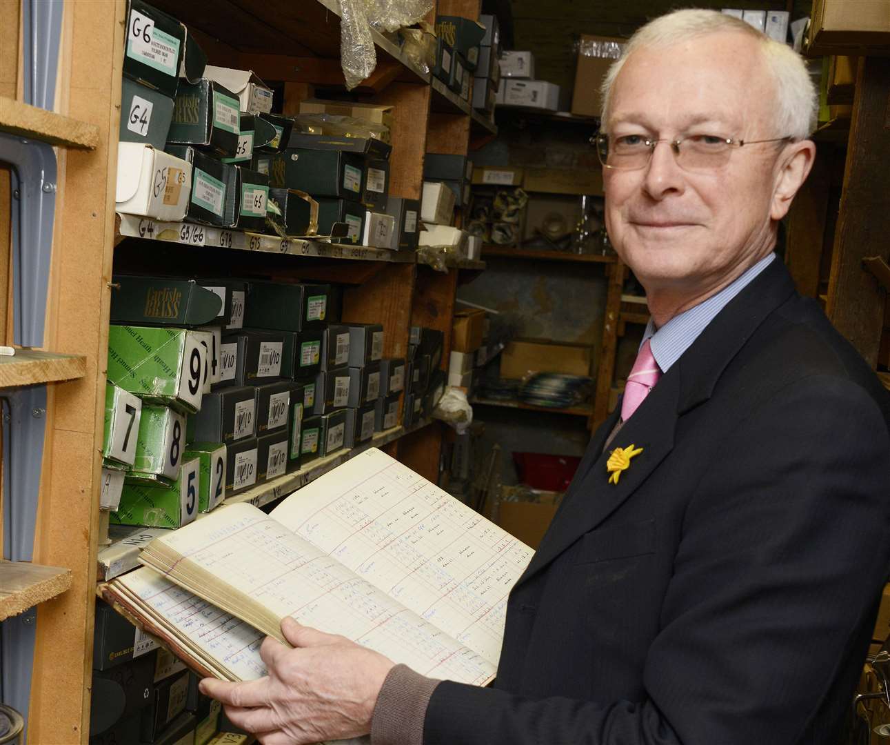Nigel Webb with one of the original ledgers for Webbs of Tenterden. Picture: Paul Amos