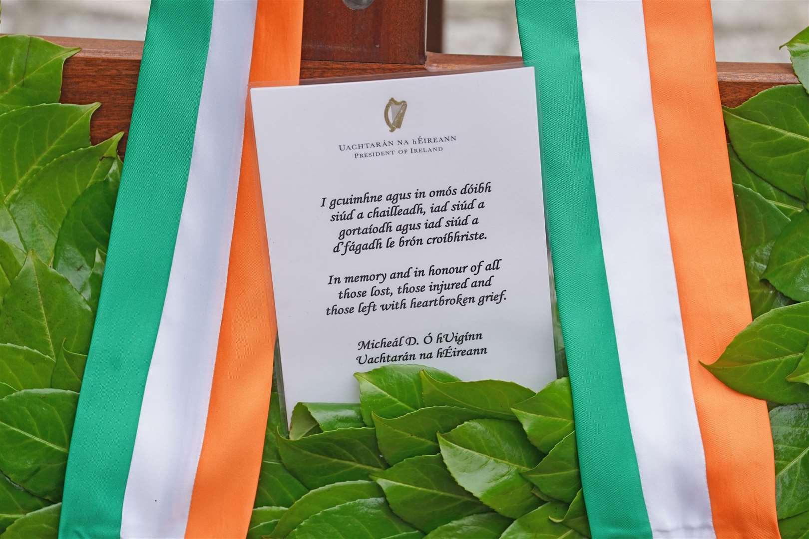 A message from President Higgins on a wreath (Brian Lawless/PA)