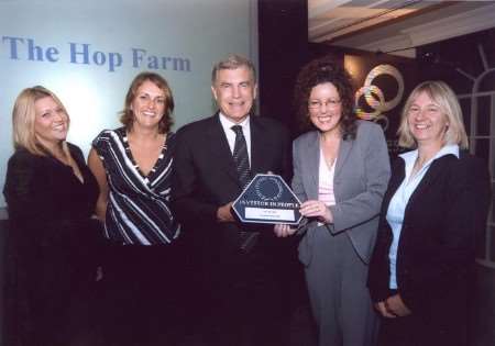 WINNER: The Hop Farm team collects the award from Sir Trevor Brooking