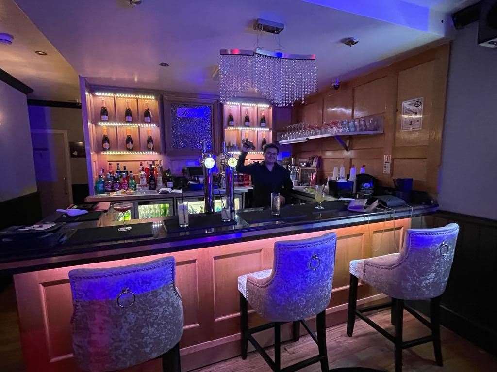 The interior of the bar includes glitter wallpaper and silver velvet seating. Picture: Charlotte Silver