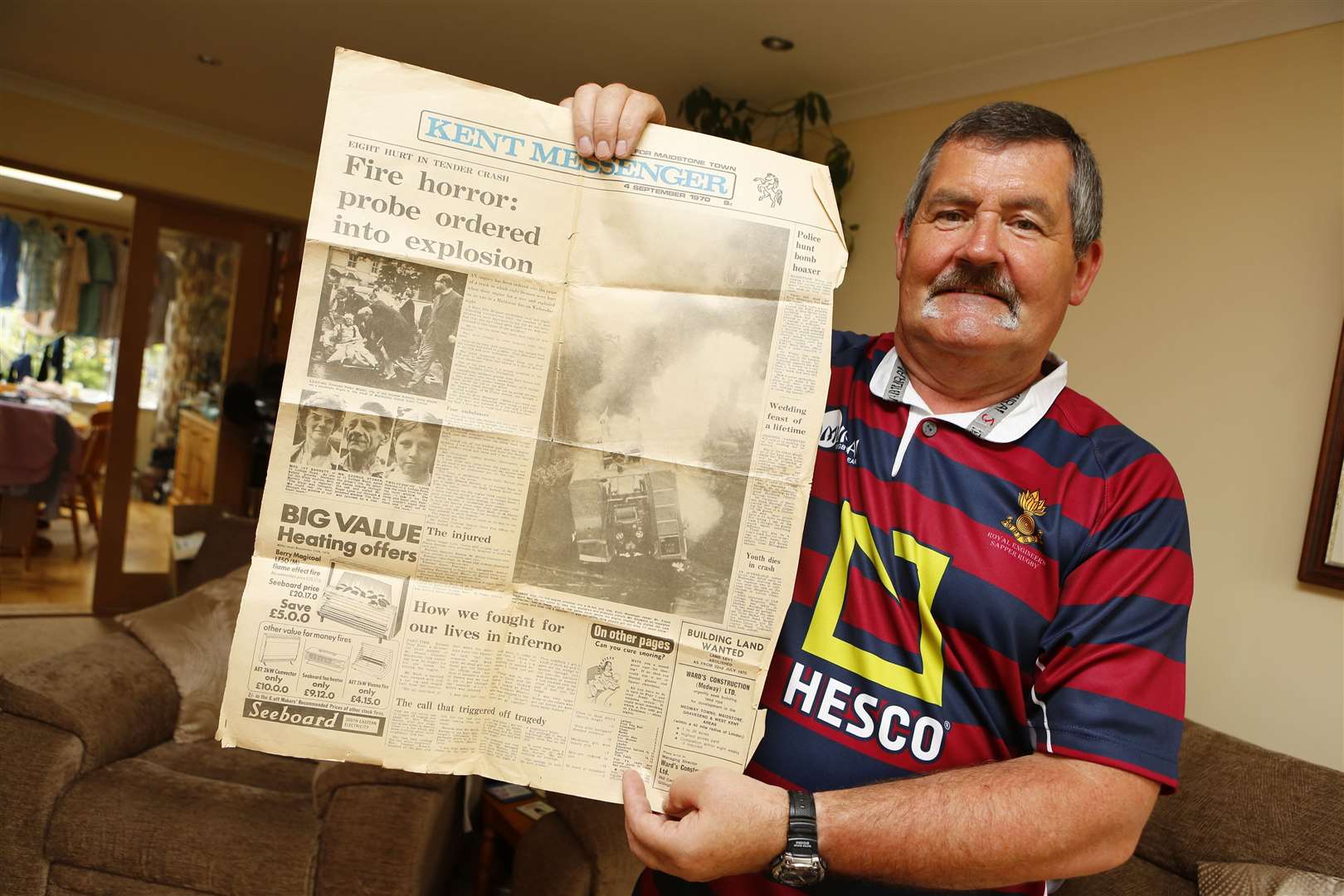 Martyn Barrett, who was 15 at the time, rushed to help the trapped firemen. He is pictured with his copy of the Kent Messenger's coverage of the crash