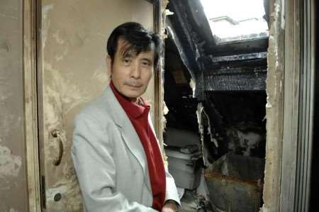 Owner and Elvis impersonator Paul Chan inside the fire-damaged building. Picture: MATTHEW WALKER