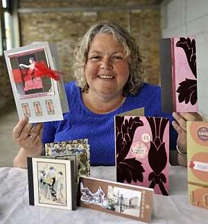 Lynn Jackson in unit one of the harbour Arm Development, with her cards.