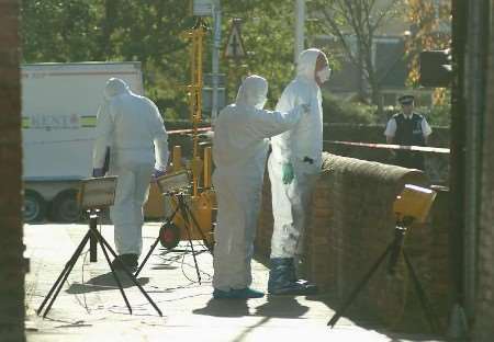 Police forensic experts working at the scene of the shooting. Pictures: GARY BROWNE