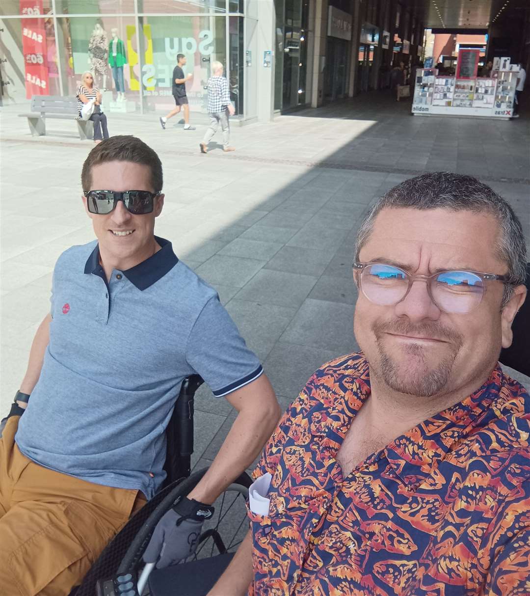Adam (left) and Tim exploring Folkestone by wheelchair