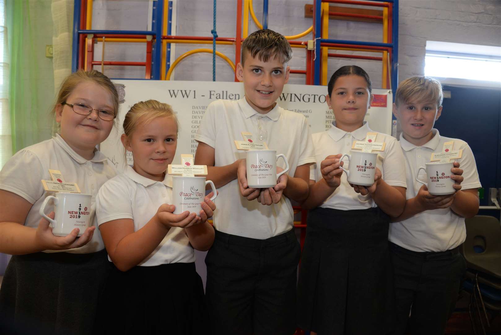 Kara, 10, Maisie, nine, Ben, 10, Lilly, nine and Harrison, 10 at Newington CE Primary School and their Peace Day mugs. Picture: Chris Davey (13441709)