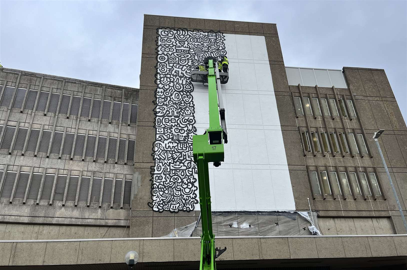 A wall of the car park was painted white to create a canvas for Mr Doodle; two cherry pickers have been set up on part of the taxi rank in Park Street