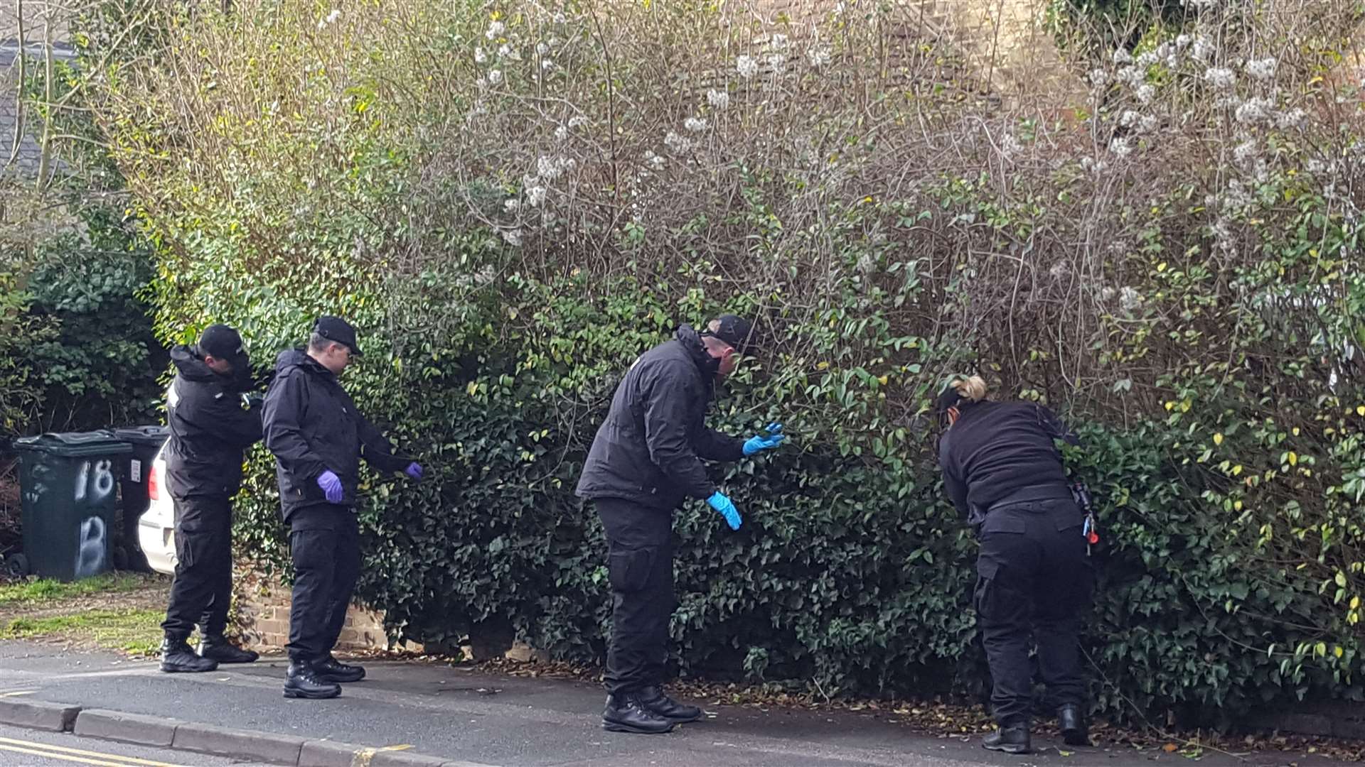 Officers in Knightrider Street looking for evidence after the murder of Wesley Adyinka