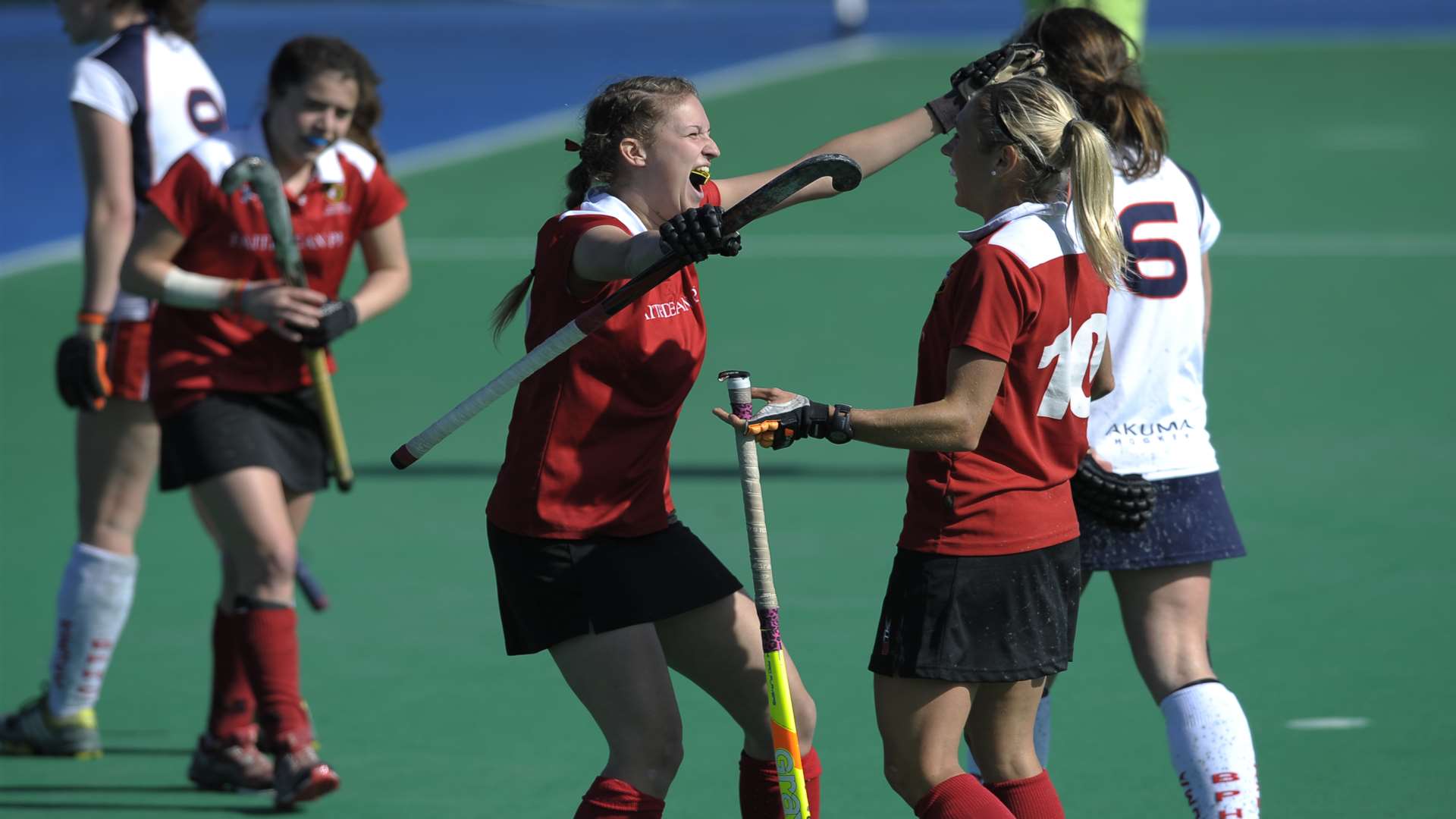 Holcombe’s Shelley Russell, right, celebrates the second goal against Brooklands Poynton Picture: Ady Kerry / England Hockey