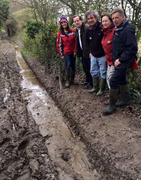 MP Charlie Elphicke looks at the damage done to the right of way near Guston with members of the White Cliffs Ramblers
