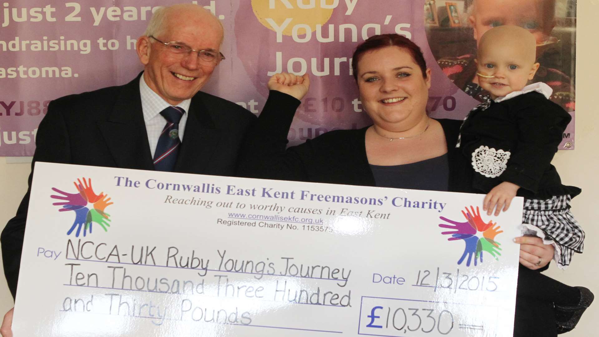 Andy Notley, Rochester Lodge, presents Vickki Young with Ruby two years a cheque for £10334.