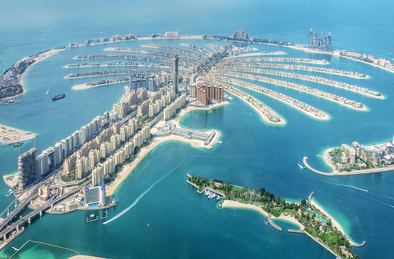 Aerial view of Dubai Palm Jumeirah island, United Arab Emirates. iStock / Delpixart