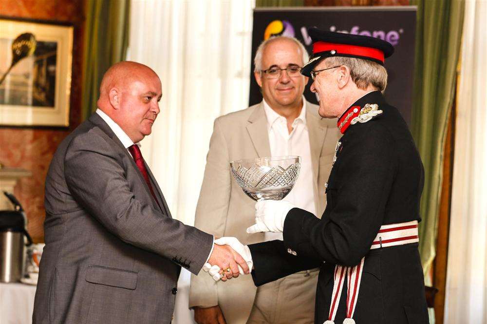 Lee Rose, left, from Woodchurch, receives Queen's Award for Enterprise from the Lord Lieutenant of East Sussex