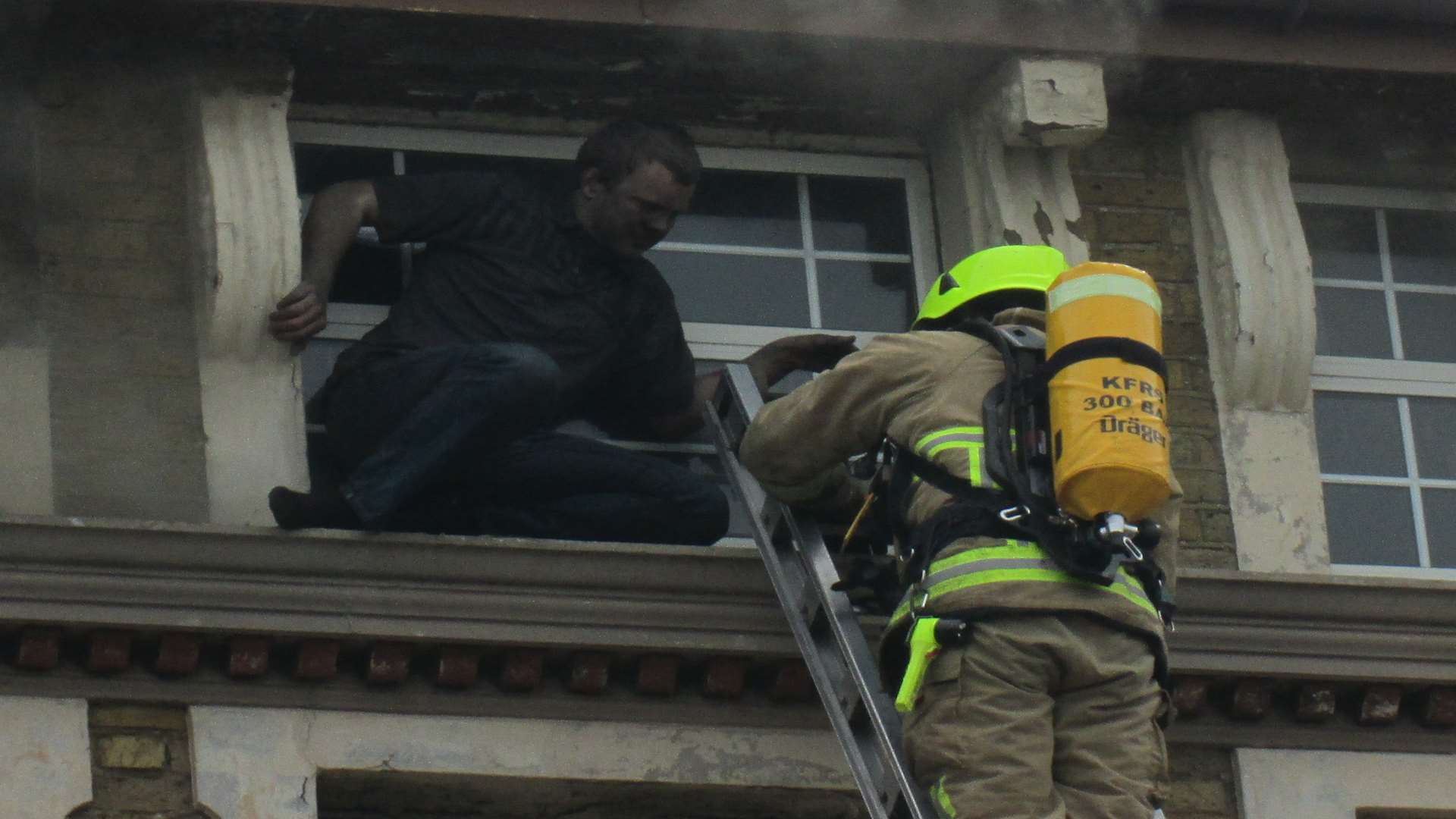 A man is rescued from the blazing flats in Sheerness