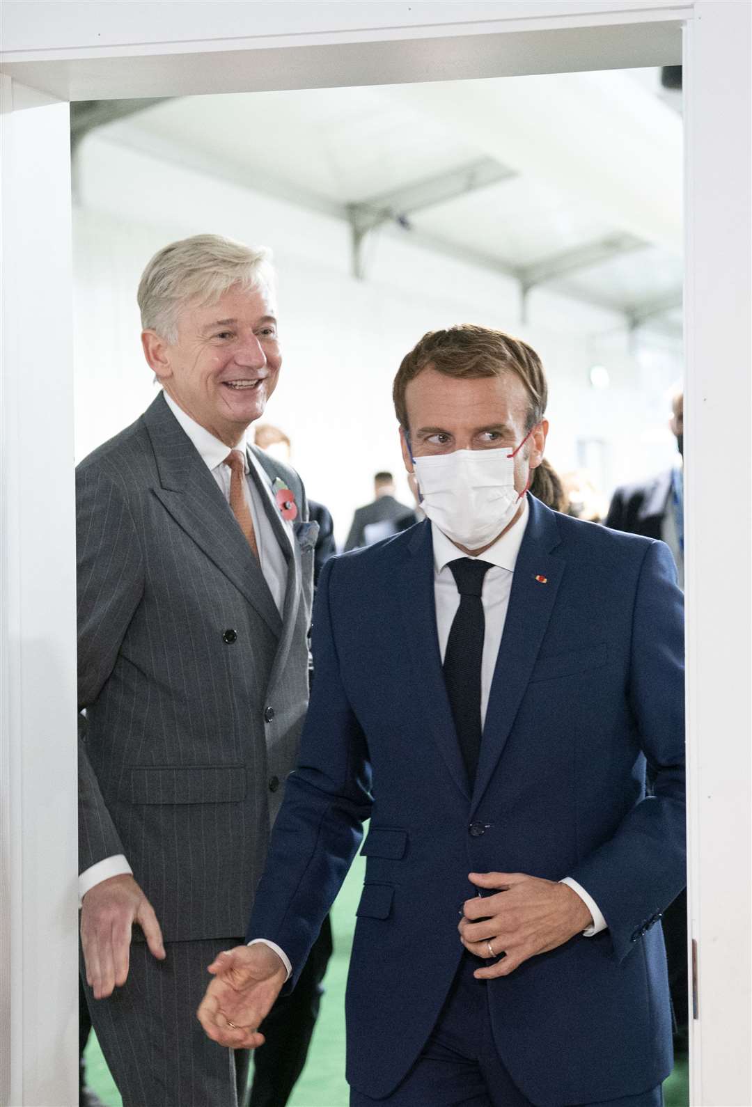 Clive Alderton (left) with the French president Emmanuel Macron at Cop26 in 2021 (Jane Barlow/PA)