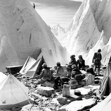 Porters enjoying the sunshine at Camp II on the East Rongbuk Glacier by Hugh Ruttledge, 1936
