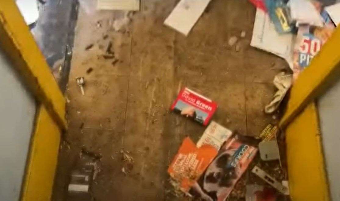 Leaflets and letters strewn near the front door.  Image: Clive Emson / YouTube