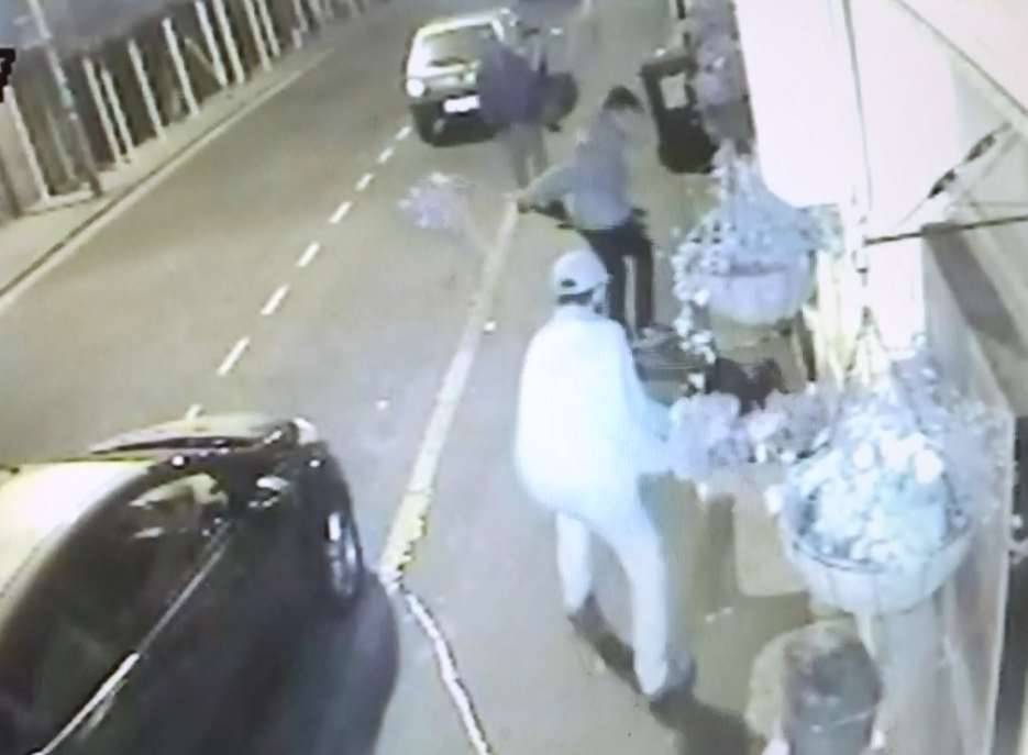 The men were caught by CCTV cameras destroying flower displays