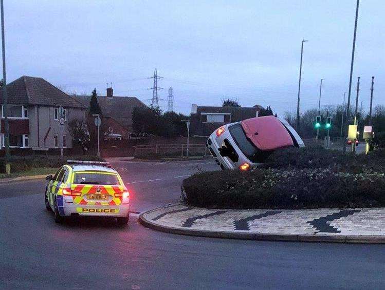 A stolen car ended up on top of a roundabout on Christmas Day. Picture: @kentpoliceroads (6231365)