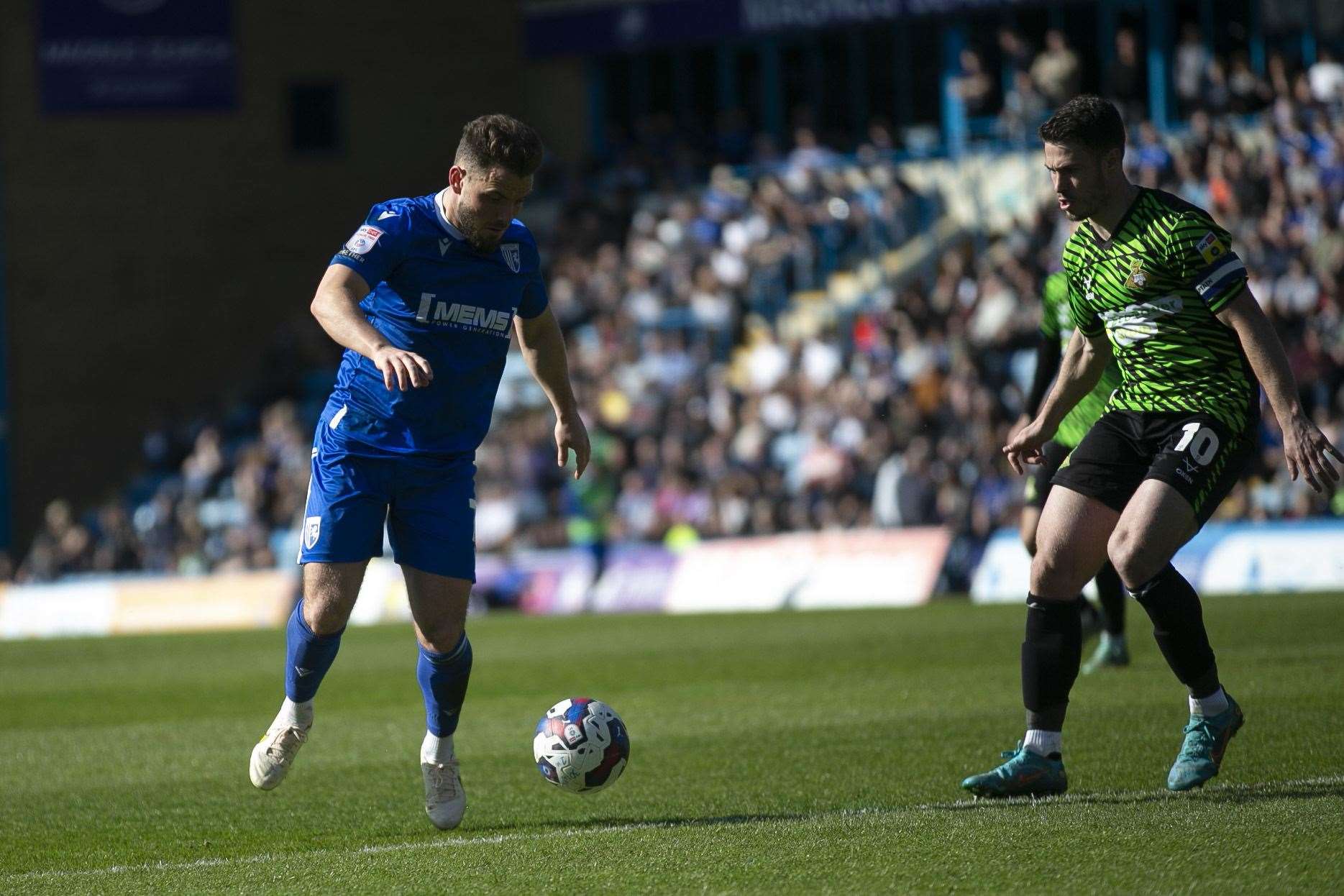 Alex MacDonald on the attack for Gillingham against Doncaster