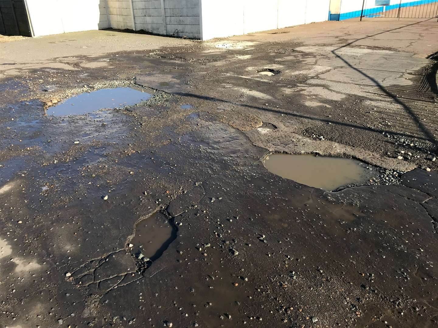 Potholes on The Strand's slipway approach