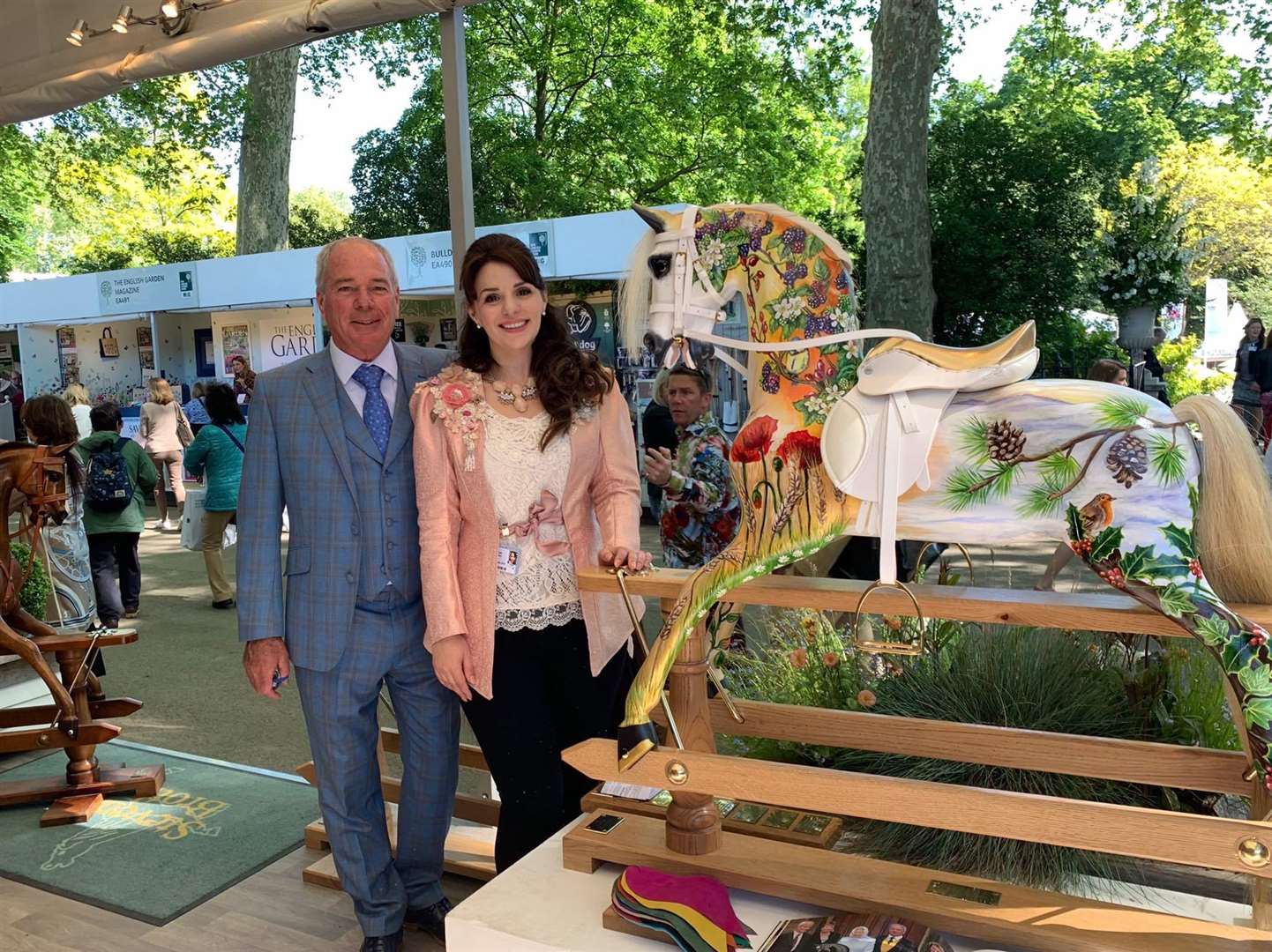 Marc Stevenson and artist Laura Jeanne with the Four Seasons rocking horse