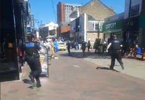 Officers running to the scene in Chatham High Street