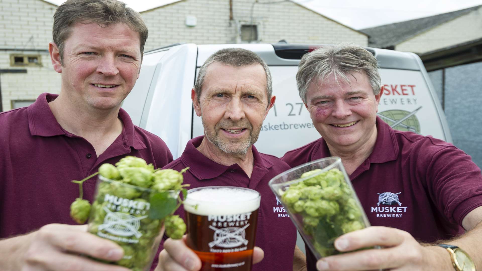 Mark Stroud, Nigel Deas and Tony Williams from the Musket Brewery raise a glass to the Kent Green Hop Festival.