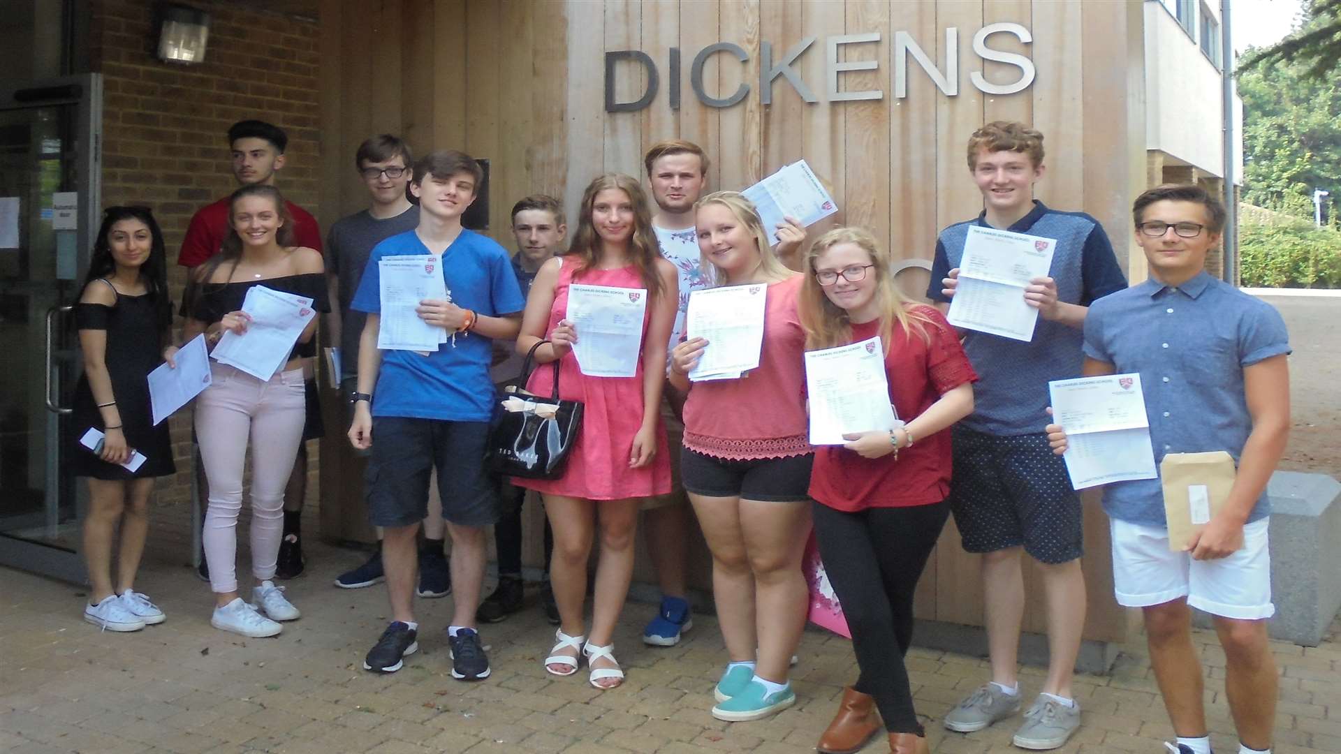 Students at The Charles Dickens School celebrate their GCSE results