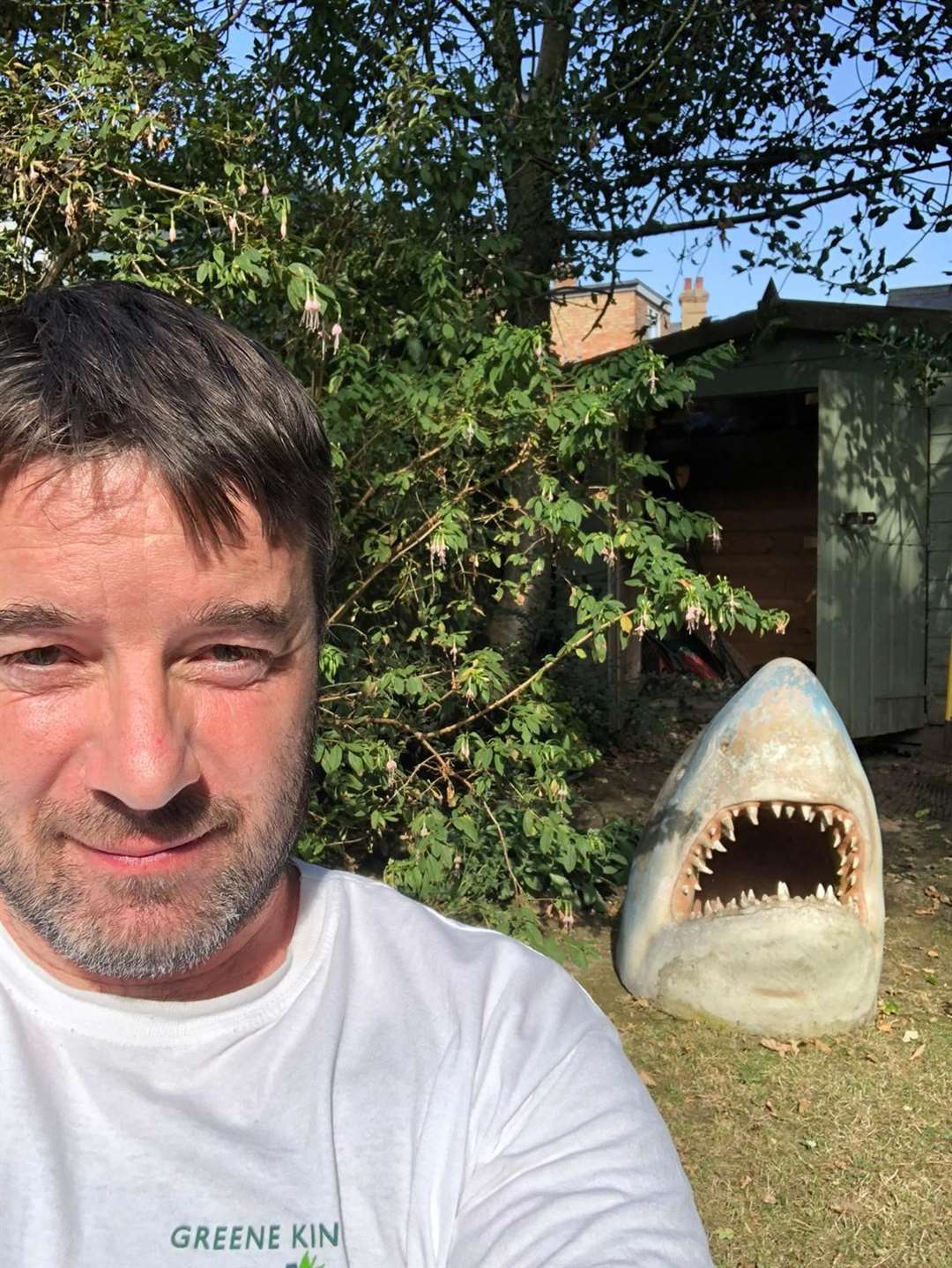 Steven Hood, who runs The Bedford, with the shark head which had become part of the family. It used to be on display at the couple's former home in Hawkenbury