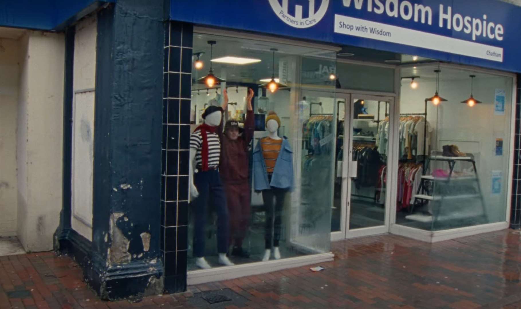 Singer venbee pictured in Chatham High Street, with Primark and charity store Wisdom Hospice. Picture: venbee/YouTube