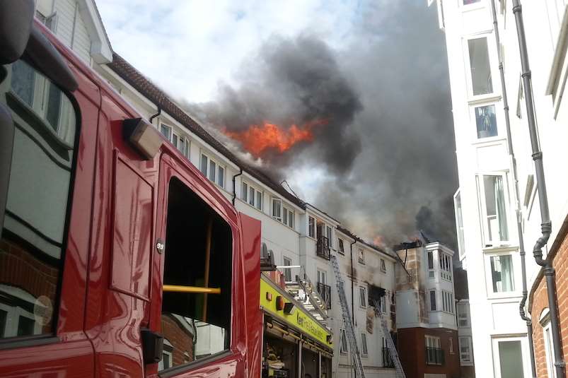The fire spreads across the roof of the block Picture: Alex Claridge