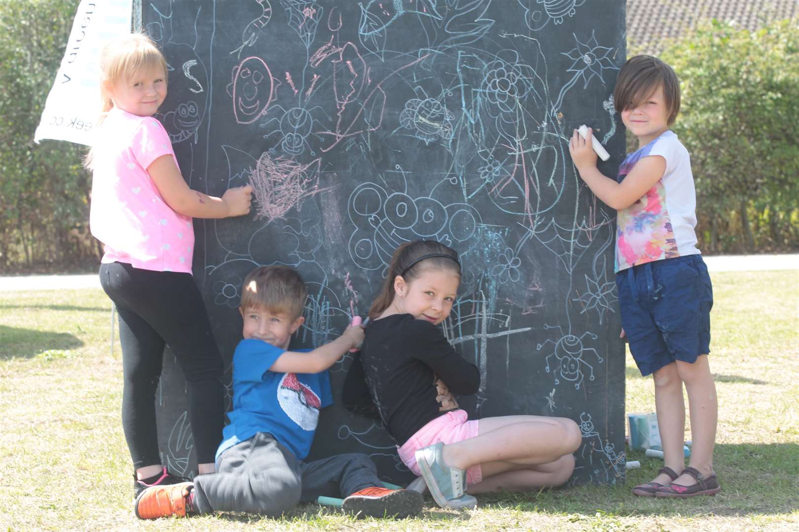 Youngsters doing some chalk art at Art in the Park in Milton Creek Country Park. Picture by: John Westhrop