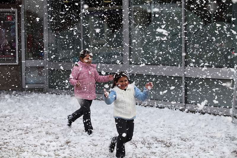 Children couldn't believe their luck when the snow began to fall outside the council offices