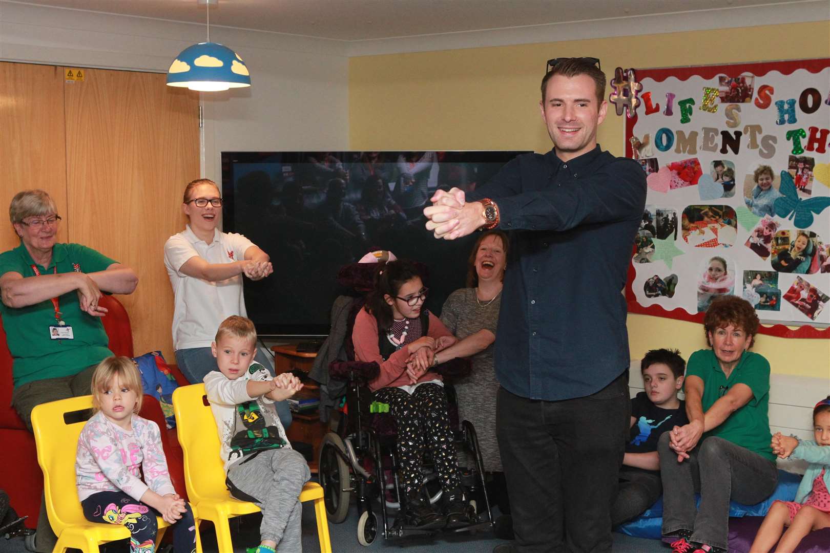 Richard Jones winner of Britain's Got Talent, a couple of years ago, warms up the audience for a magic show for children and family at Demelza Hospice Care for Children. Picture by: John Westhrop (5050866)